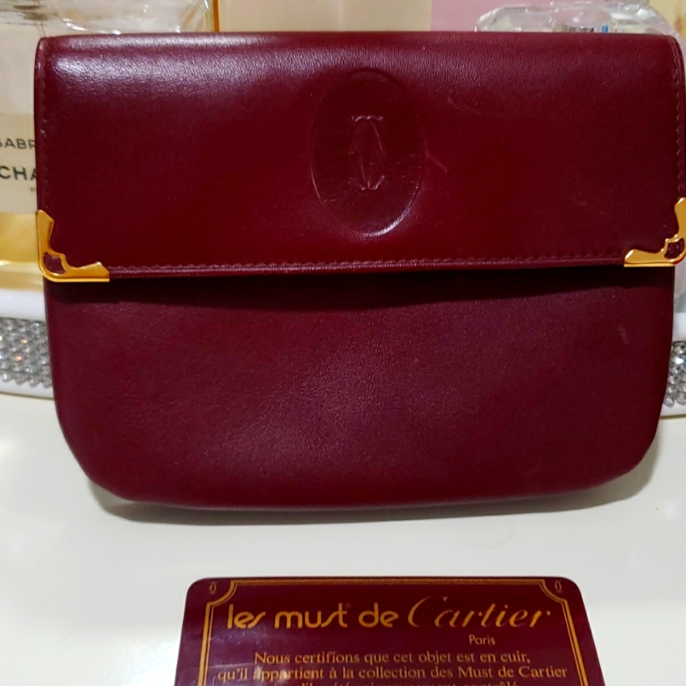 Cartier wallet in a classic burgundy calfskin leather